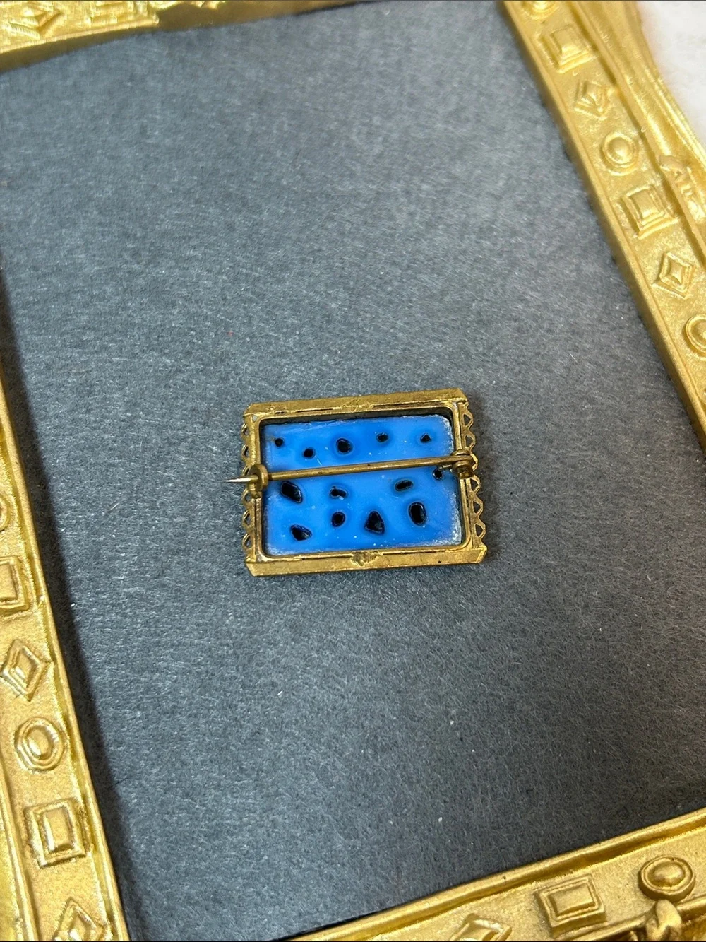 Vintage Blue Glass & Gold Tone Rectangular Pin Featuring a carved bird